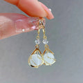 Elegant Gold Teardrop Dangle Earrings with Antique White Opal